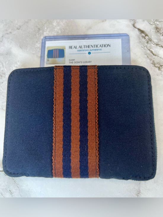 Hermes Other - Hermès Fourre Tout canvas wallets in navy blue with brown stripes. GUC with COA